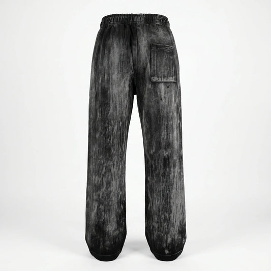 Black acid-wash jeans on a white background