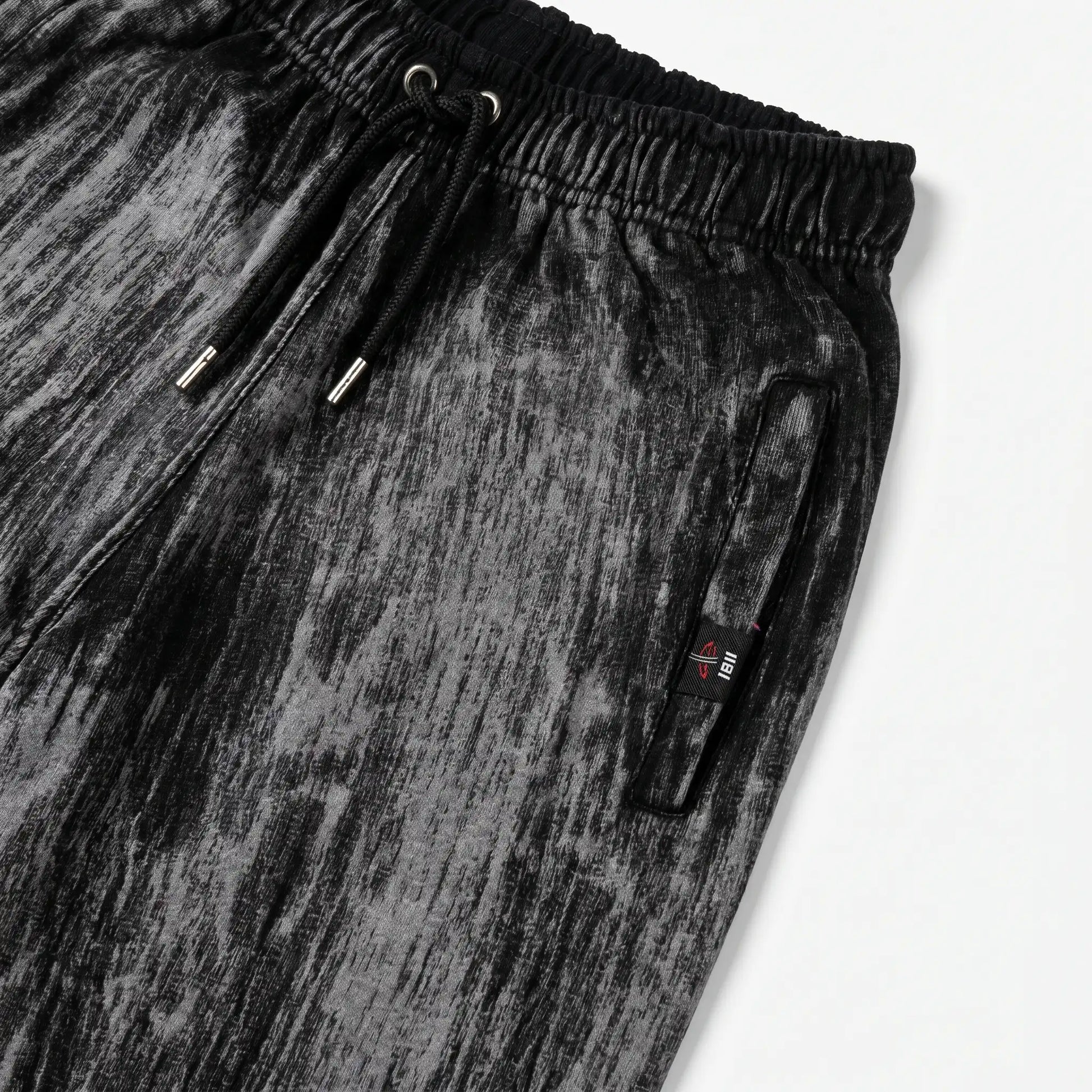 Black and gray trouser with a drawstring on a white background